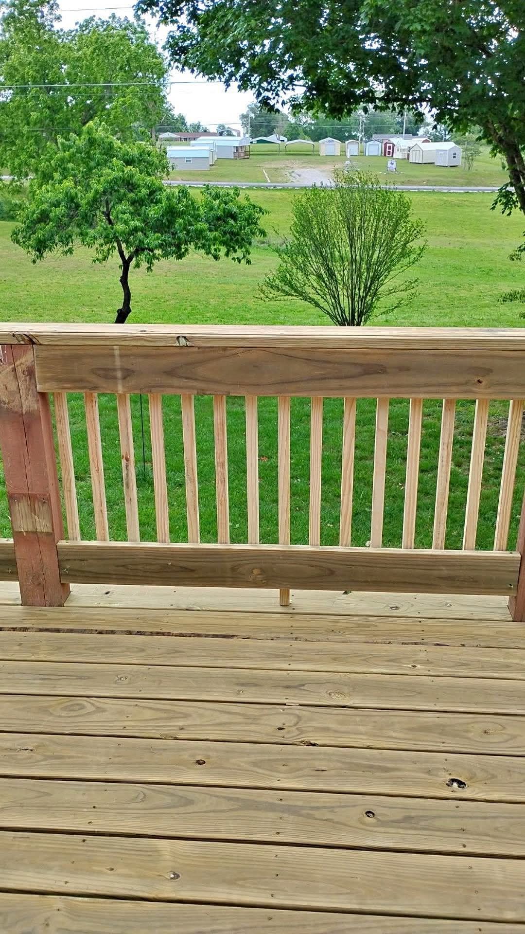 Close view of carefully fitted deck boards and wood railing